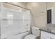 Bright bathroom featuring a glass-enclosed tub and shower combination at 155 Annabelle Branch Ln, Apex, NC 27523