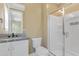 Bathroom featuring a granite countertop vanity and a glass-enclosed walk-in shower at 155 Annabelle Branch Ln, Apex, NC 27523