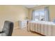 Bright bedroom with natural light, featuring a desk and neutral decor at 155 Annabelle Branch Ln, Apex, NC 27523