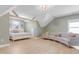 Bright bedroom with vaulted ceilings, exposed beams, hardwood floors, neutral paint, and natural light at 155 Annabelle Branch Ln, Apex, NC 27523