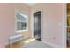 Bright bedroom with a corner view, pink walls, and a gray accent door at 155 Annabelle Branch Ln, Apex, NC 27523