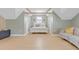 Bright bedroom with vaulted ceilings, exposed beams, hardwood floors, neutral paint, and natural light at 155 Annabelle Branch Ln, Apex, NC 27523