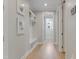 Hallway with a convenient drop zone featuring built-in seating, coat hooks, and storage shelves at 155 Annabelle Branch Ln, Apex, NC 27523