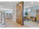 Bright home office with a large sliding barn door and views of a formal living room at 155 Annabelle Branch Ln, Apex, NC 27523