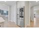 Modern stainless steel refrigerator next to doorway that enters into the living area at 155 Annabelle Branch Ln, Apex, NC 27523