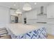 Bright kitchen features a large island with seating, stainless steel appliances and ample cabinet space at 155 Annabelle Branch Ln, Apex, NC 27523