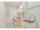 Well-organized laundry room with modern appliances and decorative wallpaper at 155 Annabelle Branch Ln, Apex, NC 27523