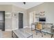 Office with desk, ceiling fan, wood flooring, and a view into a bathroom at 155 Annabelle Branch Ln, Apex, NC 27523