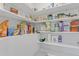 Walk-in pantry with ample shelving space for organized storage of food and household items at 155 Annabelle Branch Ln, Apex, NC 27523