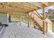 Wide-angle view of backyard patio with stone pavers, wood beams, stairs, and outdoor seating area at 155 Annabelle Branch Ln, Apex, NC 27523