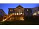View of the home's rear exterior showcasing the back porch and deck area at 155 Annabelle Branch Ln, Apex, NC 27523