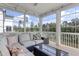 Comfortable sunroom with stylish furniture and scenic outdoor views at 155 Annabelle Branch Ln, Apex, NC 27523