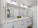 Bright bathroom with a double sink vanity, large mirror, and a glass-enclosed shower at 1641 Glazebrook Dr, Wake Forest, NC 27587