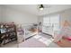 Charming bedroom with a crib, toys, and a cozy play area for a  at 1641 Glazebrook Dr, Wake Forest, NC 27587