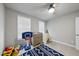 Bright bedroom with natural light, featuring a ceiling fan, and a blue geometric rug at 1641 Glazebrook Dr, Wake Forest, NC 27587
