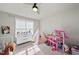 bedroom featuring a bed, playhouse, toys and cheerful decor at 1641 Glazebrook Dr, Wake Forest, NC 27587