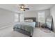 Relaxing bedroom boasts ample natural light, ceiling fan and plush carpet at 1641 Glazebrook Dr, Wake Forest, NC 27587