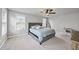 Serene bedroom offers a ceiling fan, and lots of natural light from two windows at 1641 Glazebrook Dr, Wake Forest, NC 27587
