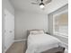 Bright bedroom featuring a ceiling fan, neutral walls, and a comfortable bed with fresh linens at 1641 Glazebrook Dr, Wake Forest, NC 27587