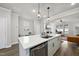 Bright, modern kitchen features stainless steel appliances, undermount sink and quartz countertops, perfect for entertaining at 1641 Glazebrook Dr, Wake Forest, NC 27587