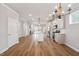 Open-concept kitchen with white cabinets, stainless steel appliances, and a center island with bar seating at 1641 Glazebrook Dr, Wake Forest, NC 27587