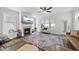 Cozy living room with fireplace, modern ceiling fan and ample natural light throughout at 1641 Glazebrook Dr, Wake Forest, NC 27587