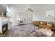 Inviting living room featuring a fireplace, large windows, and access to an outdoor space at 1641 Glazebrook Dr, Wake Forest, NC 27587