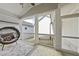 Cozy screened-in porch with a decorative rug and a stylish, comfortable papasan chair at 1641 Glazebrook Dr, Wake Forest, NC 27587