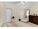 This bedroom offers a neutral carpet and walls, a ceiling fan, and a window for natural light at 17 Nicklaus Way, Clayton, NC 27520