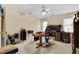 Bedroom with a ceiling fan, a table, a desk with many drawers, and carpeted floors at 17 Nicklaus Way, Clayton, NC 27520