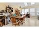 Bright dining area featuring skylights, a ceiling fan, and ample storage shelves at 17 Nicklaus Way, Clayton, NC 27520