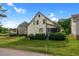 A charming home with a well-maintained yard and mature shrubs, and an inviting screened-in porch at 17 Nicklaus Way, Clayton, NC 27520