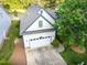 Charming home featuring a two-car garage and manicured landscaping in a tranquil setting at 17 Nicklaus Way, Clayton, NC 27520