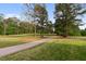 The golf course offers beautiful scenery with towering trees, rolling greens, and a paved path at 17 Nicklaus Way, Clayton, NC 27520