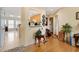 Hallway view with connections to the kitchen, bathroom, and other rooms with hardwood floors at 17 Nicklaus Way, Clayton, NC 27520