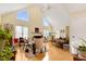Spacious living room with vaulted ceiling, fireplace, and ample natural light at 17 Nicklaus Way, Clayton, NC 27520