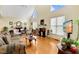 Inviting living room with hardwood floors, fireplace, and arched windows at 17 Nicklaus Way, Clayton, NC 27520
