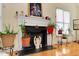 Cozy living room with a fireplace, complemented by decor and plants at 17 Nicklaus Way, Clayton, NC 27520