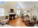 Bright living room with vaulted ceilings, fireplace, and expansive windows at 17 Nicklaus Way, Clayton, NC 27520