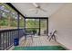 Enjoy outdoor living on this screened porch with ceiling fan and views of the surrounding trees at 17 Nicklaus Way, Clayton, NC 27520