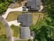 An aerial view of a property showcasing its backyard, driveway, and proximity to surrounding greenery at 2003 Wa Wa Ave, Durham, NC 27707
