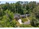 Aerial shot highlighting a home's layout, lush surroundings, and clearly defined property lines at 2003 Wa Wa Ave, Durham, NC 27707