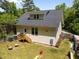 A serene backyard featuring a cozy patio and a well-maintained lawn, perfect for relaxation and outdoor activities at 2003 Wa Wa Ave, Durham, NC 27707