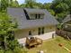 Home backyard featuring a wood deck, lawn, new roof, and beige siding at 2003 Wa Wa Ave, Durham, NC 27707