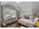 Bright and cheerful room with hardwood floors and two windows at 2003 Wa Wa Ave, Durham, NC 27707