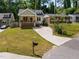 A lovely home with a well-manicured lawn, inviting porch, and a long driveway at 2003 Wa Wa Ave, Durham, NC 27707