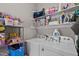 Functional laundry room with washer, dryer, shelving, and storage for all your cleaning supplies at 2003 Wa Wa Ave, Durham, NC 27707