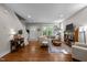 Bright living room with hardwood floors, large windows, and comfortable seating at 2003 Wa Wa Ave, Durham, NC 27707