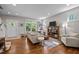 Cozy living room with hardwood floors, large windows, and comfortable seating at 2003 Wa Wa Ave, Durham, NC 27707