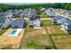 Aerial view of neighborhood homes, showing backyards and community pool under construction at 2014 Anna Lilley Dr, Fuquay Varina, NC 27526